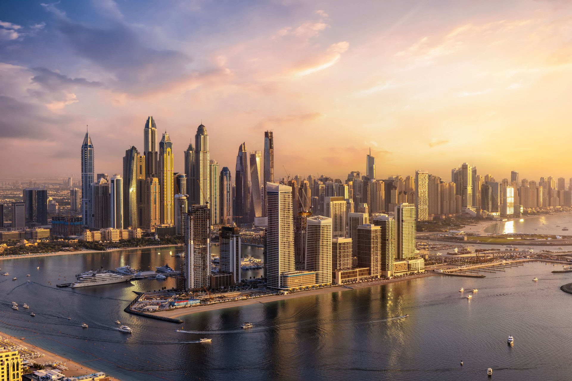 Panoramic sunset view of the modern skyline of Dubai Marina